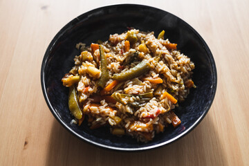 plant-based food, vegan fried rice with stir fry vegetables in sweet and sour sauce