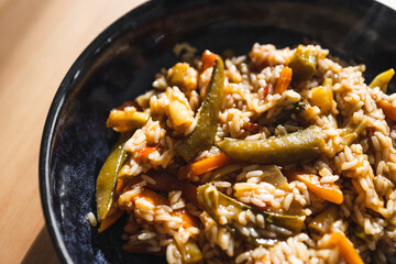 plant-based food, vegan fried rice with stir fry vegetables in sweet and sour sauce