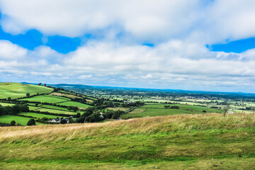 landscape with green field and blue sky