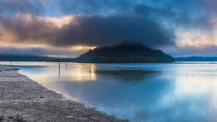 Misty morning panorama at the river