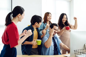 Excited group business people feeling euphoric celebrating online win success achievement result,...