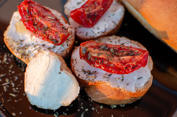 sandwiches with curd cheese and dried tomatoes. food breakfast on a plate
