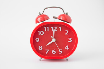 red alarm clock  on a white background