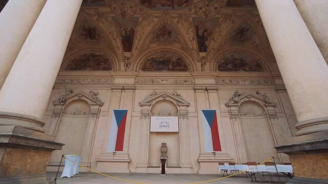 View of Czech Republic flags at Prague's senate building, dolly backwards