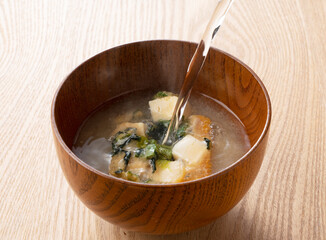 Pour hot water into freeze-dried miso soup.