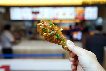 Sweet and sour chicken - Fried chicken with tamarind sauce topped with chopped spring onion.