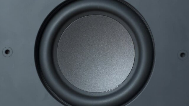 Subwoofer at extreme volume in slow motion, face on. 4K