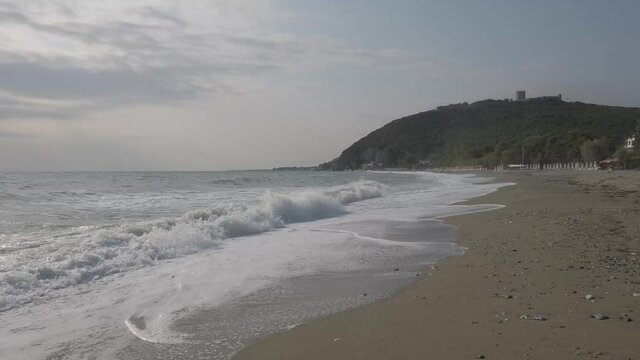 rough sea in platamon Greece with the castle in the background