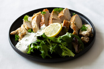 Greek Style Chicken with Salad and Tzatziki Sauce