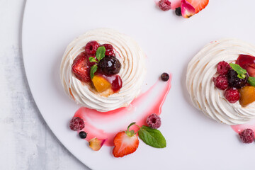 delicious cake with berries on a white plate