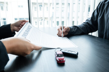 The car dealer advises the customer about insurance details and car rental information Ready...