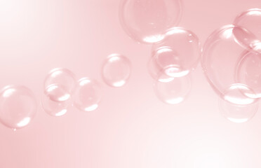 Beautiful blurry clear pink soap bubbles float background 