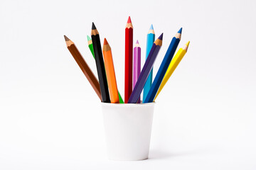 Various color pencils in white cup isolated on the white background
