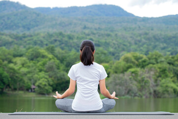 Naklejka na ściany i meble Young woman practicing yoga in the nature.Meditation.