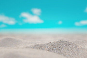 Fototapeta na wymiar Beautiful sand dunes on a blurred sea background. Outdoor nature Pastel tone style