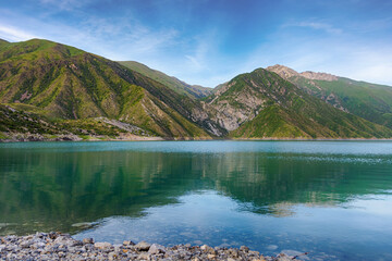 Beautiful mountain turquoise color lake Karasuu. Kyrgyzstan.