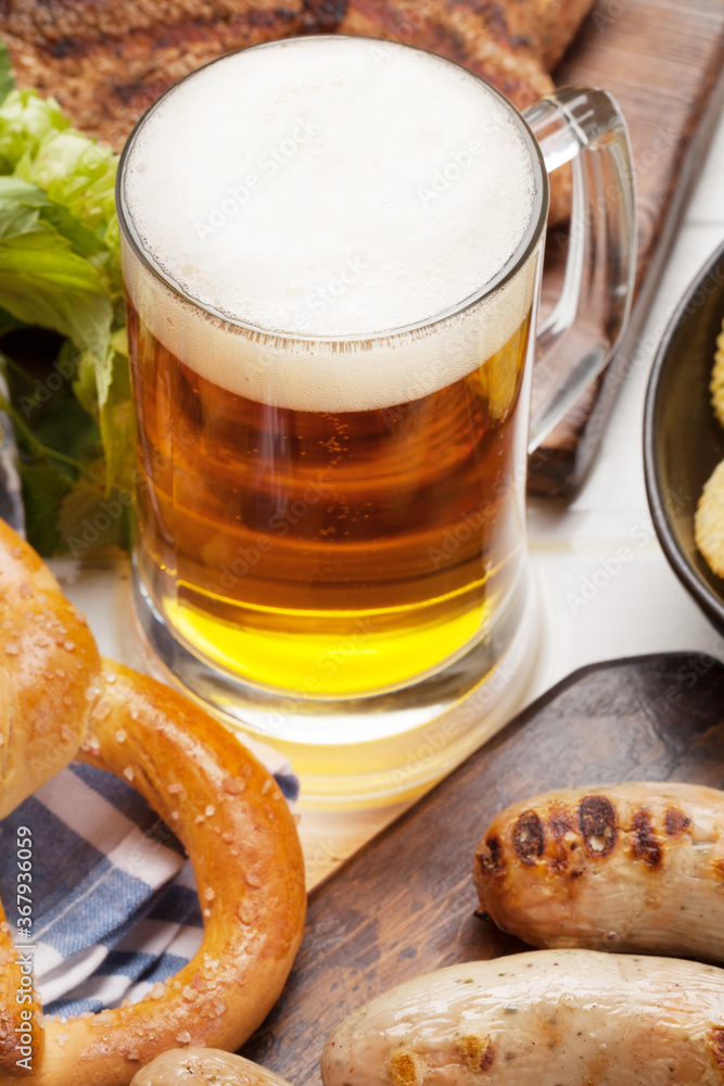 Wall mural Oktoberfest set. Pretzels, sausages and lager beer