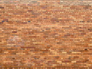 Old wall with yellow and brown bricks