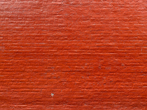 Bright Red Painted Old Brick Wall