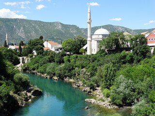 Fototapeta na wymiar Neretva river section in Mostar old city. Landscape and natural environment in Mostar old city.