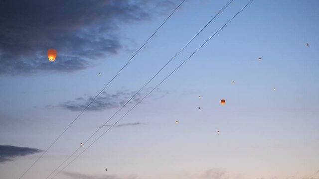 The sky lanterns fly up highly in the sky