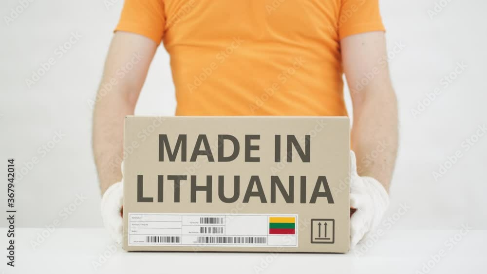 Poster carton with made in lithuania text being placed on the table