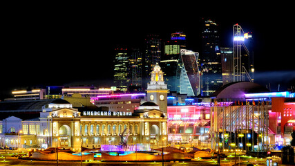 downtown moscow city at night modern architecture landmark with Kievskaya railway station at Europe square against business financial district skyscrapers background. Street view. Wide panorama