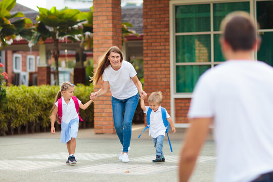 School Pick Up. Mother And Kids After School.