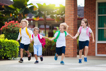 Child going back to school. Start of new school year after summer vacation. Little girl with backpack and books on first school day. Beginning of class. Education for kindergarten and preschool kids.