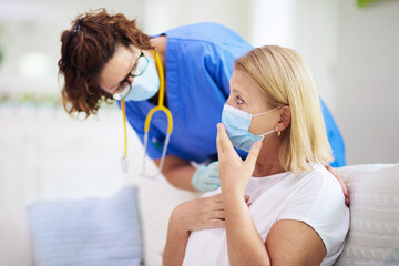 Doctor examining sick patient. Ill woman in clinic