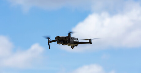 Fototapeta na wymiar A flying drone armed with camera