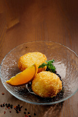 potato croquette balls with sauce on a plate.Top view