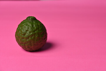 Fresh kaffir lime ( bergamot / citrus hystrix D.C ) isolated on colorful background