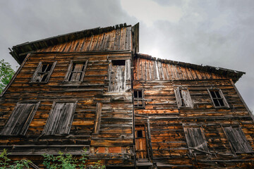 Traditional wooden cottages at sunny day in the countryside