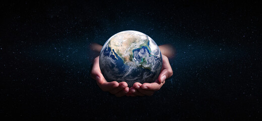 earth in hands on space. green planet on hand. save of earth. environment concept for background...