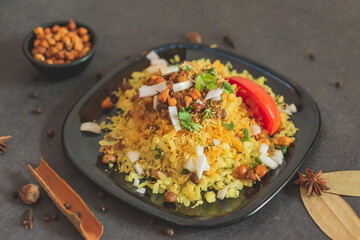 Sprouts and Poha . Deliciously steamed beaten rice, fragrant poha that is a breakfast staple in all of India . Eat with sprouts and tomatoes. 