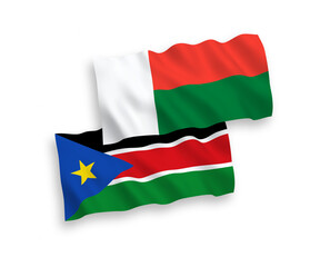 Flags of Republic of South Sudan and Madagascar on a white background