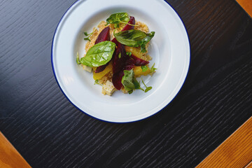 Salad with beetroot, oranges, grapefruit, radish,feta cheese and fresh greenery. Organic fruit vegetable salad.