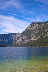Bohinj lake shore with mountain views in Slovenia.