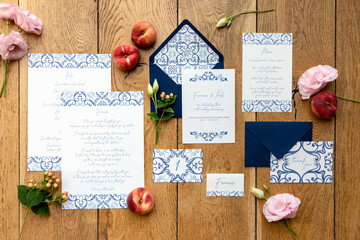 Elegant invitations near fruits and flowers