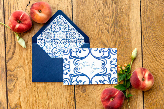 Peaches and flowers near greeting card