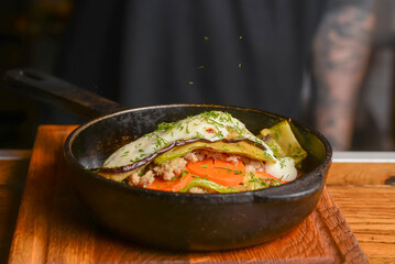 Tasty roasted chicken with vegetable and herbs in a frying pan. Delicious dinner. Healthy diet.