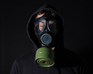 Man in a gas mask in the smoke