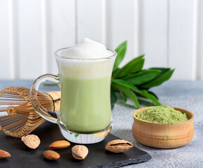 Matcha cappuccino with almond milk cup close-up