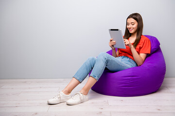 Portrait of her she nice attractive lovely winsome focused cheerful cheery girl sitting in bag...