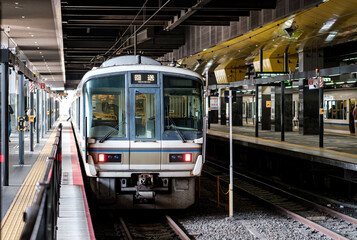 Japanese local train for the Sanin line towards Saga Arashiyama in Kyoto Station