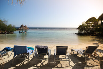 chairs  for relax on resort beach with view of Caribbean sea
