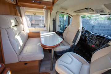 van modern table and front seat interior in camper new motorhome for rv vanlife
