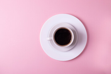 Obraz na płótnie Canvas espresso in a white ceramic cup on pink