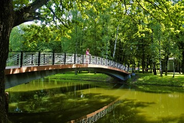 
girl on the bridge in the park
